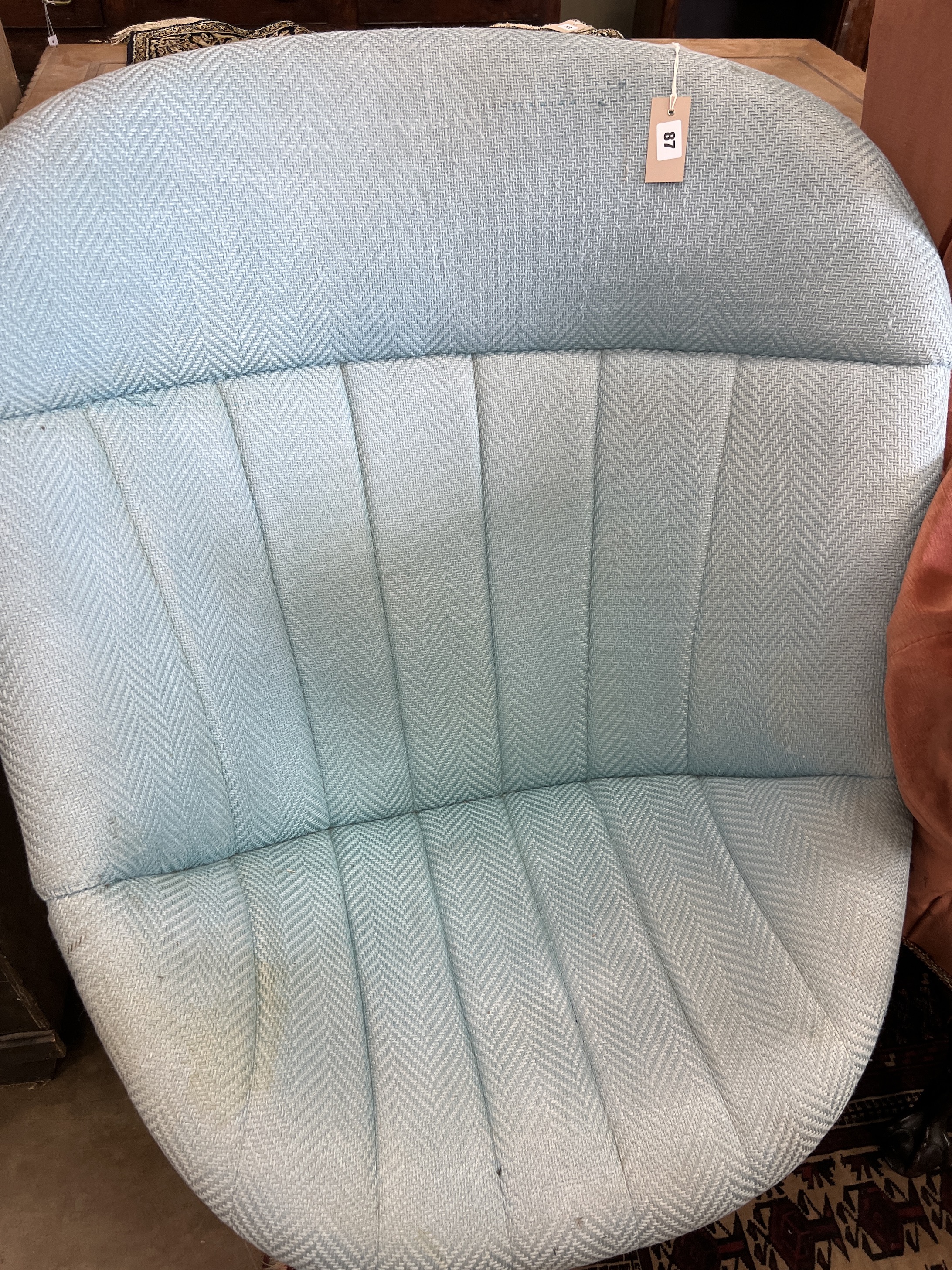 A mid century upholstered egg chair on chrome swivel base, width 86cm, depth 80cm, height 94cm